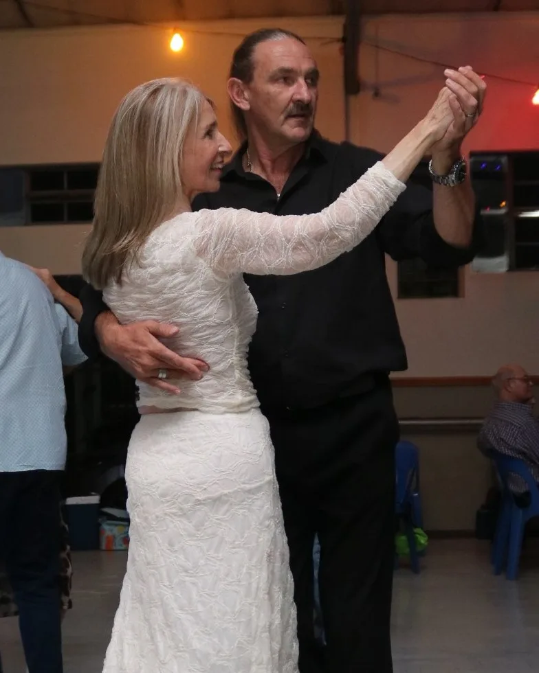 Dance instructor Gideon Stander guiding a private couple through a ballroom promenade in Centurion